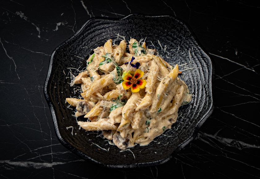 Penne in creamy parmesan sauce with mushrooms