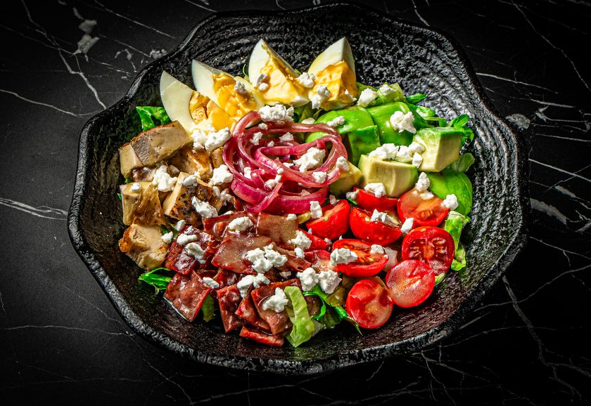 Cobb salad with egg, tomato, red onion and feta