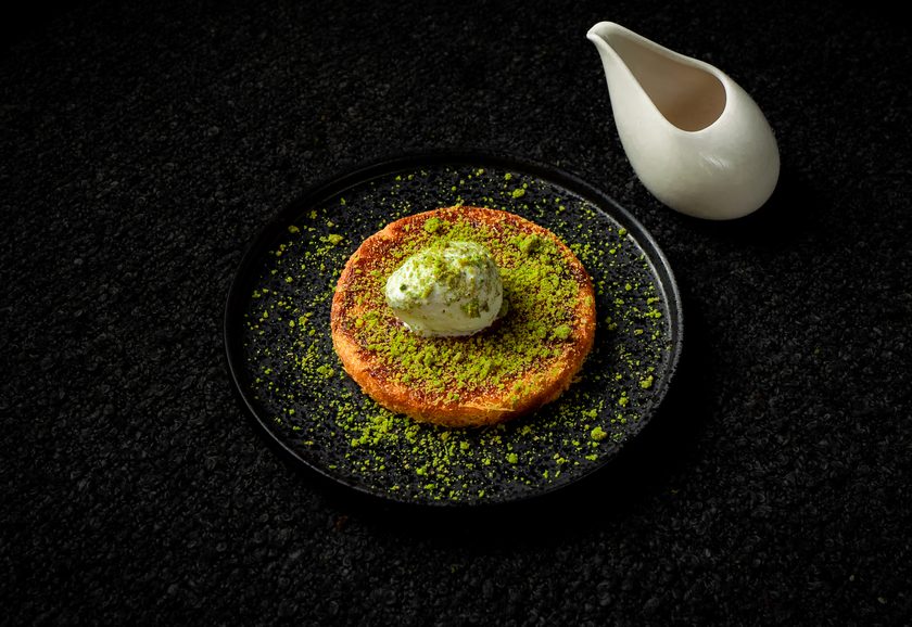 Kunefe dusted with pistachio and topped with a scoop of ice cream