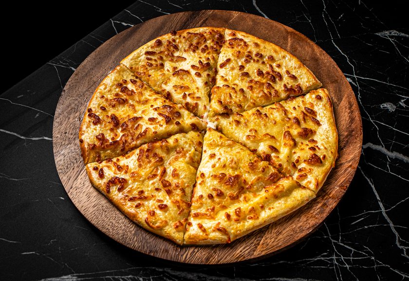 Round khachapuri megruli with cheese baked on top