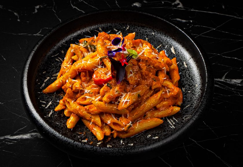 Penne in a rich tomato sauce topped with grated parmesan