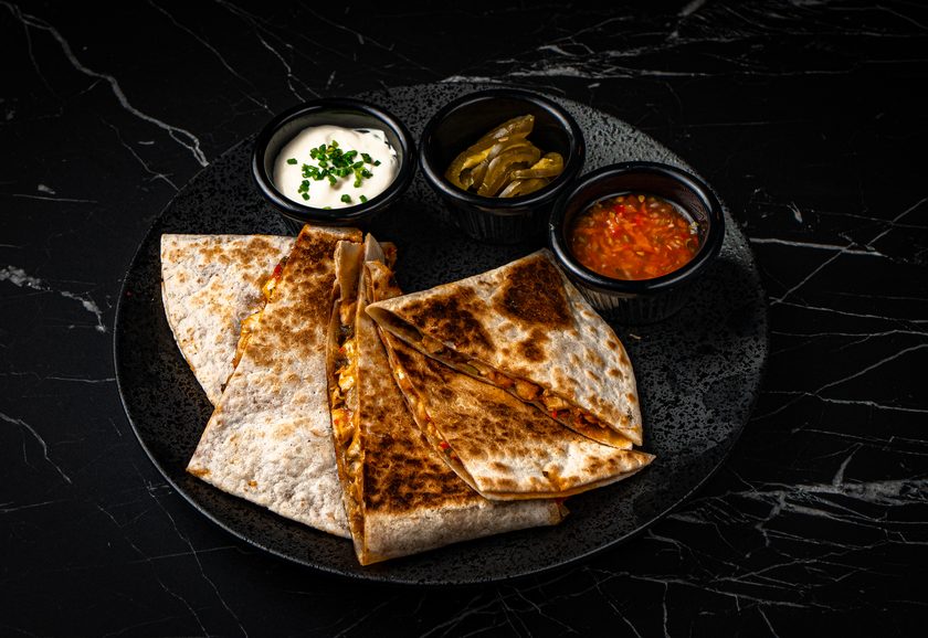 Quesadilla wedges with salsa and sour cream