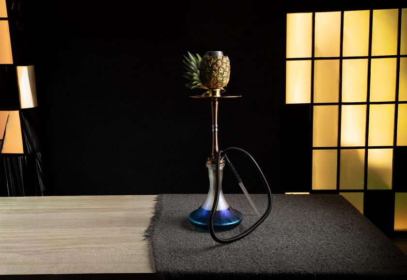 A shisha with a fresh pineapple as the head