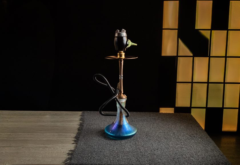 A shisha with a dark ceramic signature bowl
